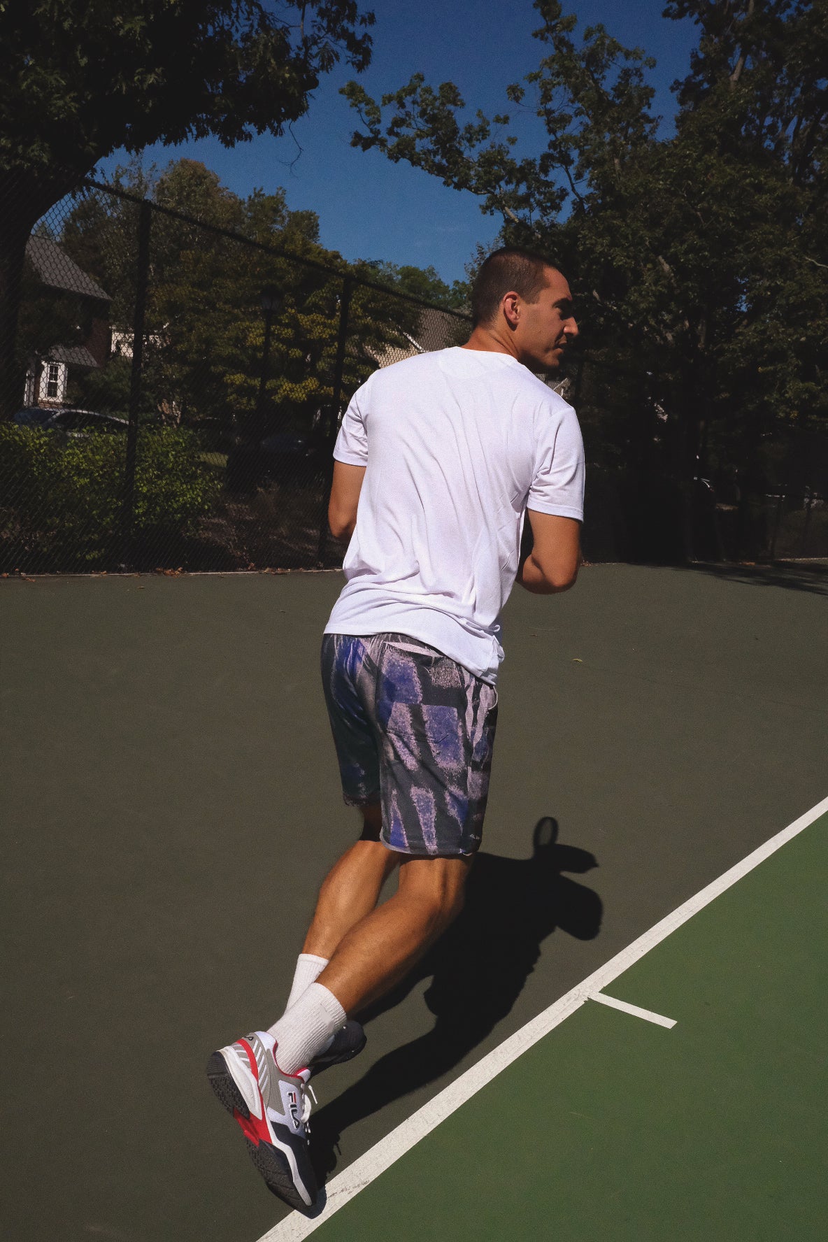 DISTRESSED PERFORMANCE SHORTS